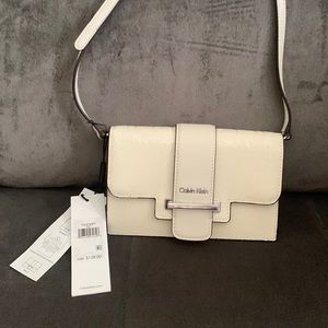 Calvin Klein crossbody or wallet (see pic 2).  Never used.